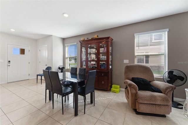 dining space featuring a healthy amount of sunlight and light tile patterned floors