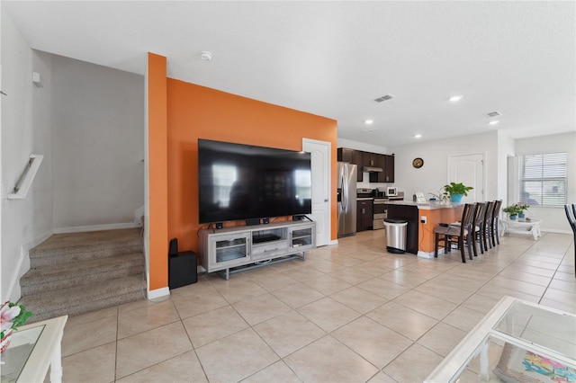 living room featuring light tile patterned floors