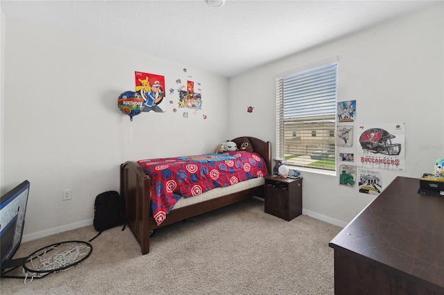 bedroom with light colored carpet