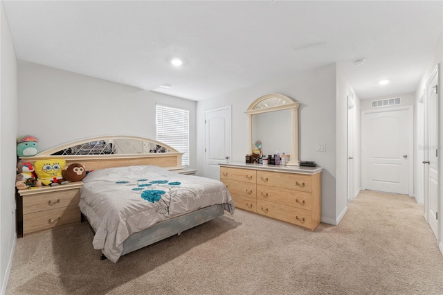 bedroom with light carpet