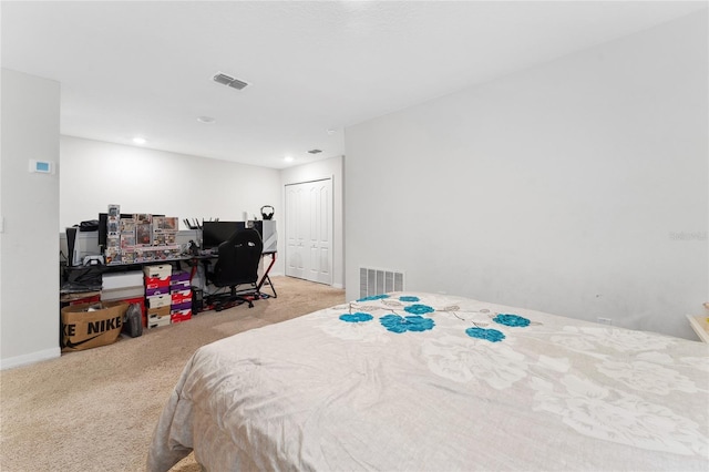 bedroom with light colored carpet and a closet