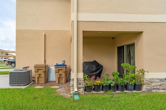 exterior space featuring grilling area and central air condition unit