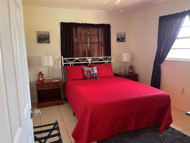 tiled bedroom with ceiling fan