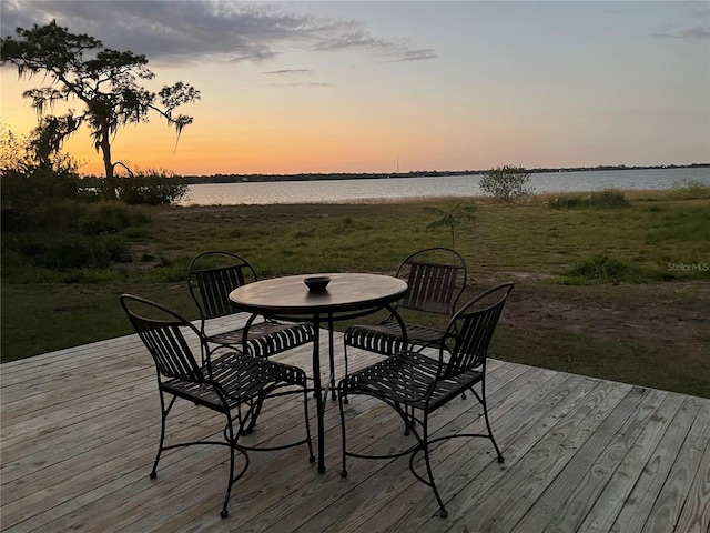 deck at dusk with a water view