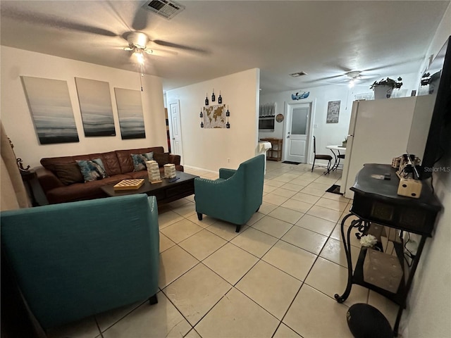 tiled living room featuring ceiling fan