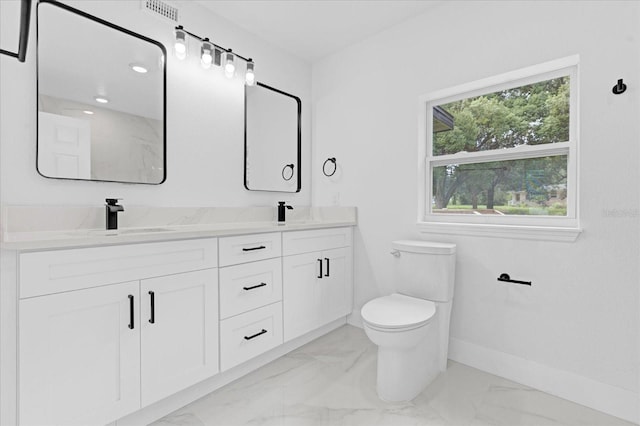 bathroom with toilet and vanity