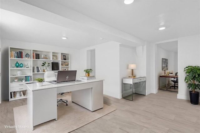 office space with light hardwood / wood-style floors