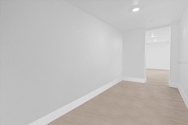 unfurnished room featuring light wood-type flooring