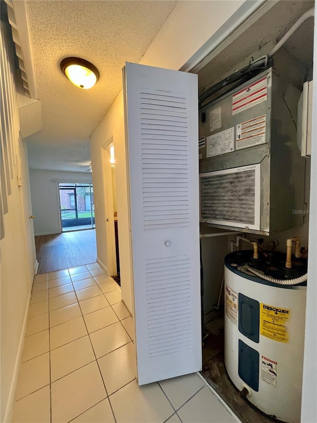 utility room with electric water heater