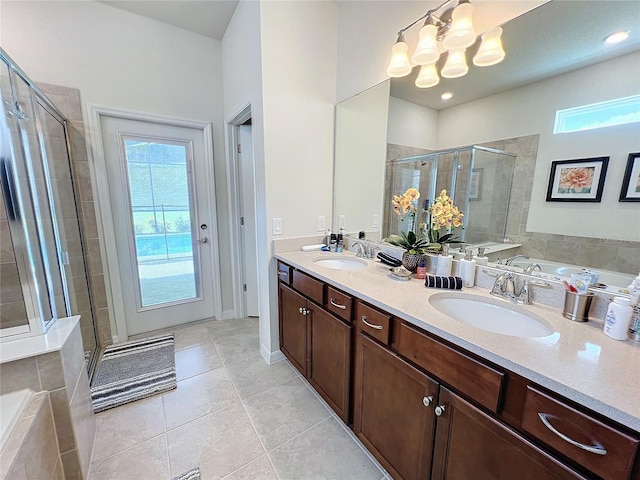 bathroom with vanity, tile patterned floors, and independent shower and bath