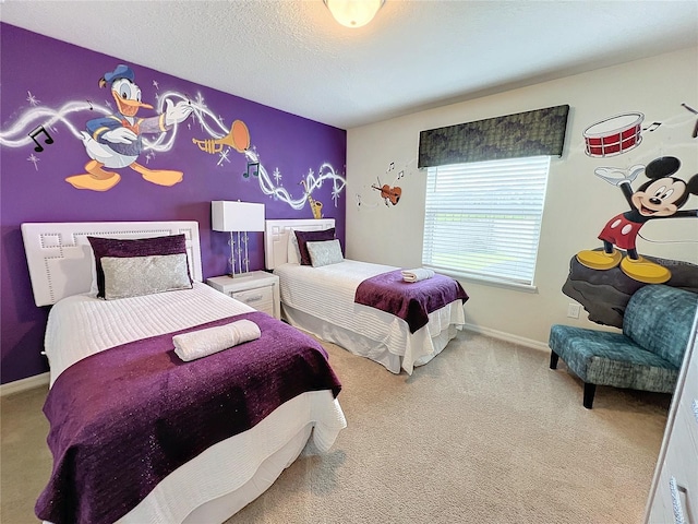 bedroom with a textured ceiling and carpet floors