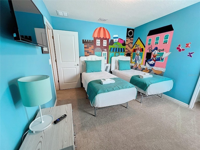 carpeted bedroom with a textured ceiling