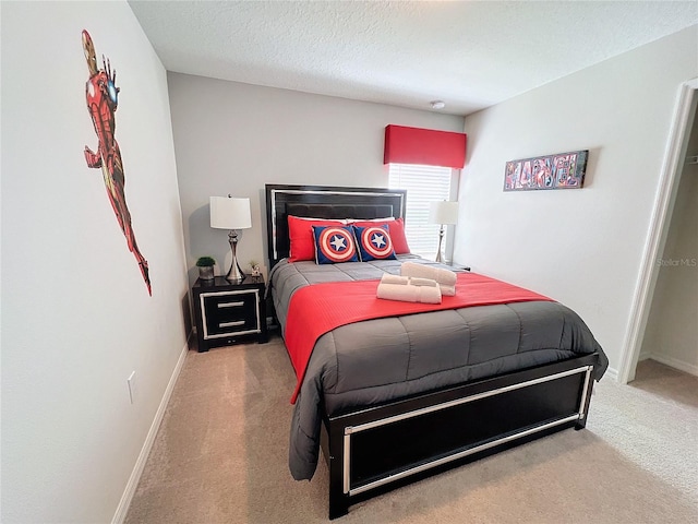 carpeted bedroom with a textured ceiling