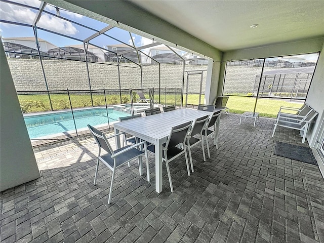 view of patio / terrace with a fenced in pool and glass enclosure