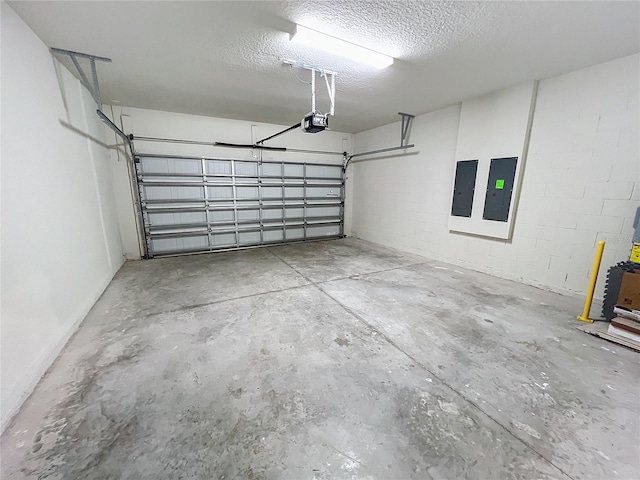 garage featuring a garage door opener and electric panel