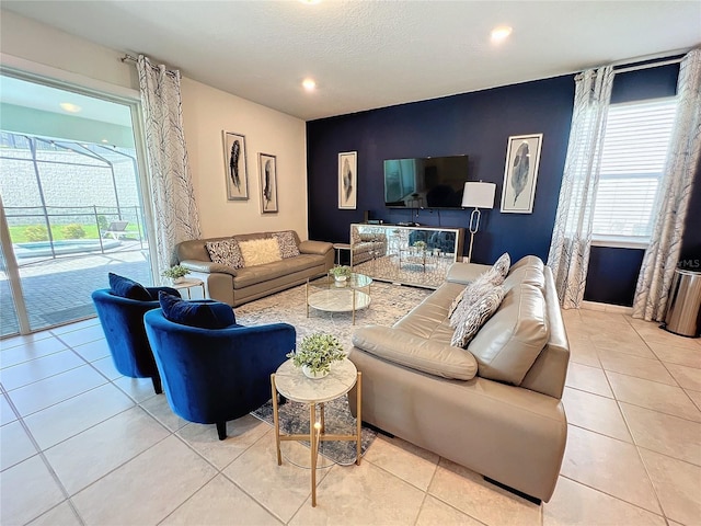 tiled living room featuring a textured ceiling