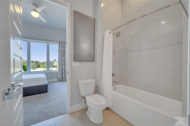 bathroom with ceiling fan, shower / bath combo with shower curtain, toilet, and tile patterned floors