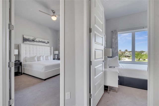 bedroom with light carpet and ceiling fan