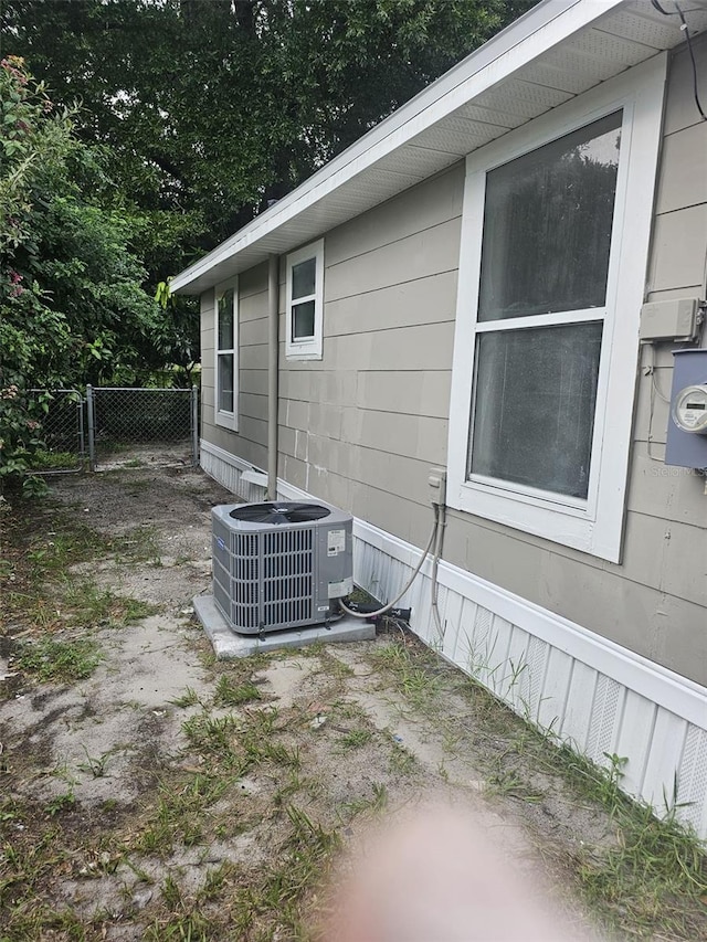 view of side of home featuring cooling unit