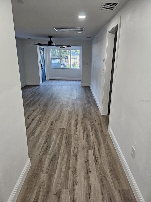 hallway with wood-type flooring