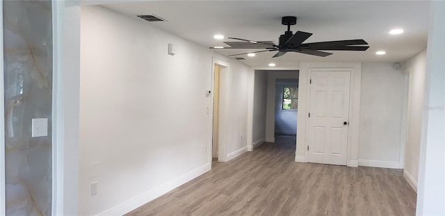 hallway with light hardwood / wood-style flooring