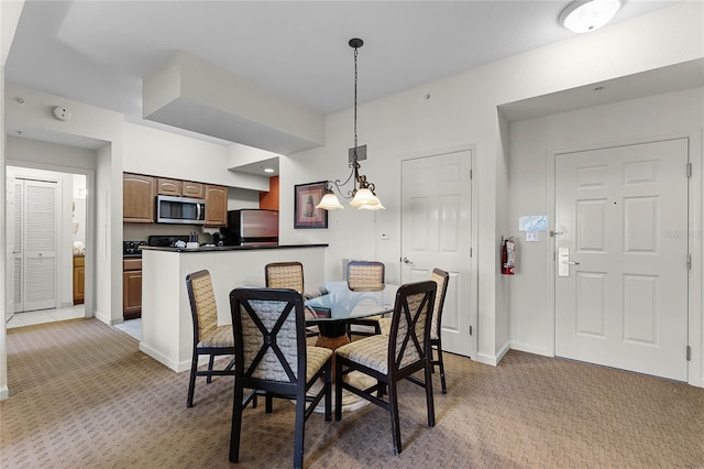 dining area with light colored carpet