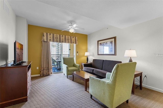 carpeted living room featuring ceiling fan