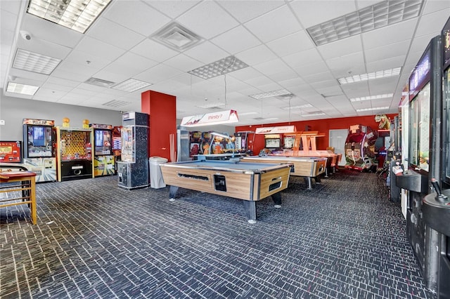 game room featuring dark carpet, a drop ceiling, and pool table