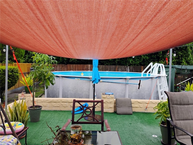 view of patio / terrace featuring a fenced in pool