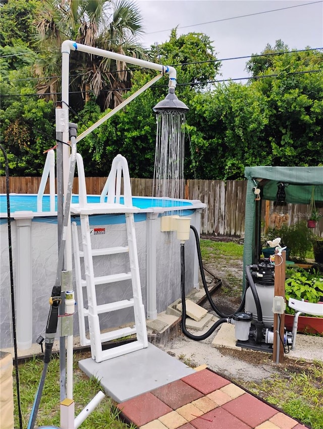 view of patio with a fenced in pool