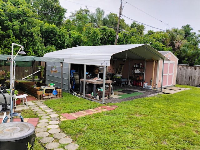 rear view of house with a lawn and a storage unit