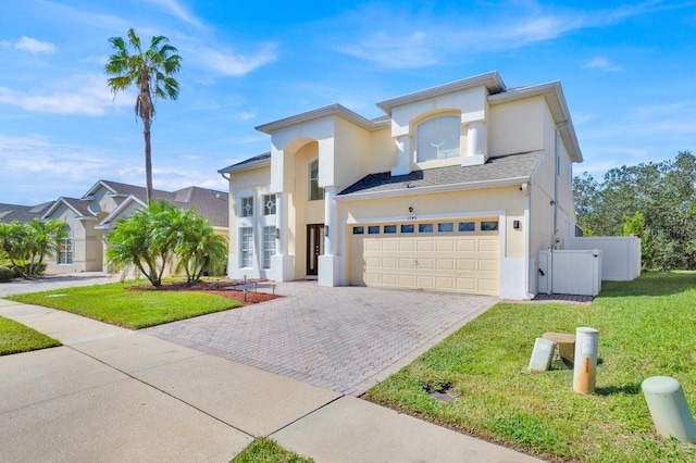 view of front facade with a front yard and a garage