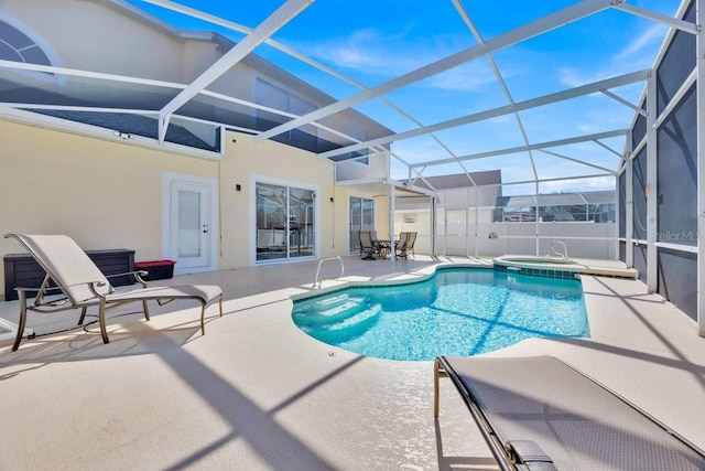 view of swimming pool featuring a patio and a lanai