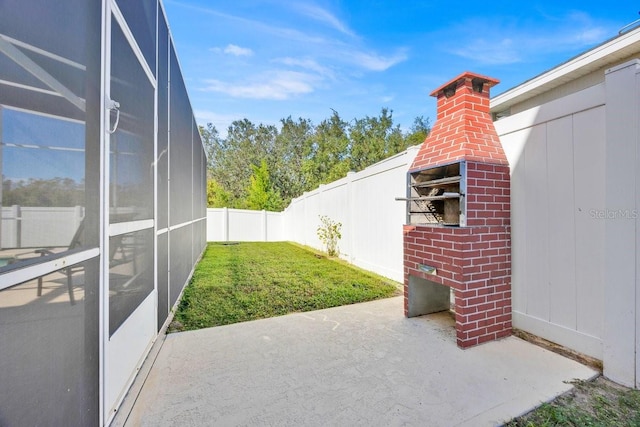 view of patio / terrace with glass enclosure