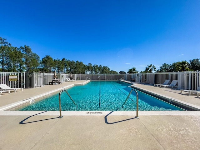 view of swimming pool featuring a patio