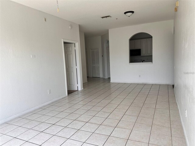 spare room with light tile patterned floors