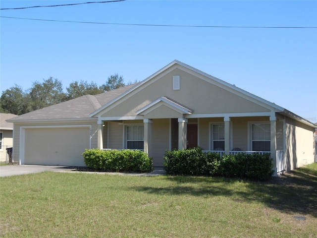 view of front facade featuring a garage, covered porch, and a front lawn