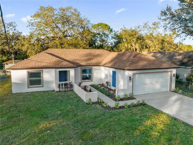 single story home with a garage and a front yard