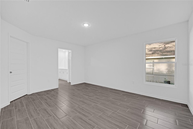 spare room featuring hardwood / wood-style flooring