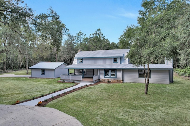 view of front of home with a front yard and a deck