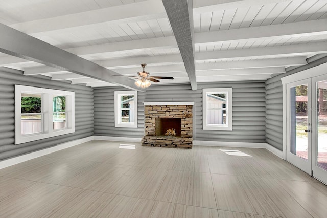 interior space with a healthy amount of sunlight and a stone fireplace