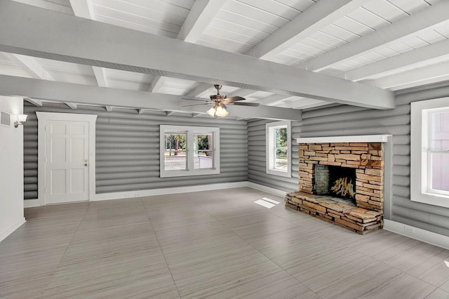 unfurnished living room featuring wooden ceiling, a fireplace, ceiling fan, and beamed ceiling