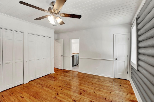 unfurnished bedroom with ensuite bath, light hardwood / wood-style floors, ceiling fan, and crown molding