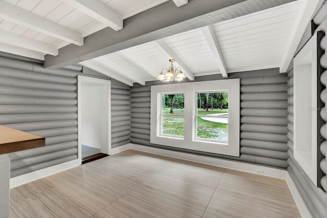 interior space with an inviting chandelier, vaulted ceiling with beams, and wooden ceiling