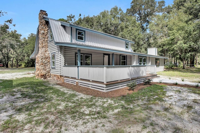 view of front of home featuring a front yard and a porch