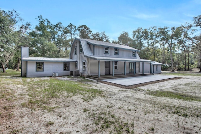 back of property featuring central AC unit