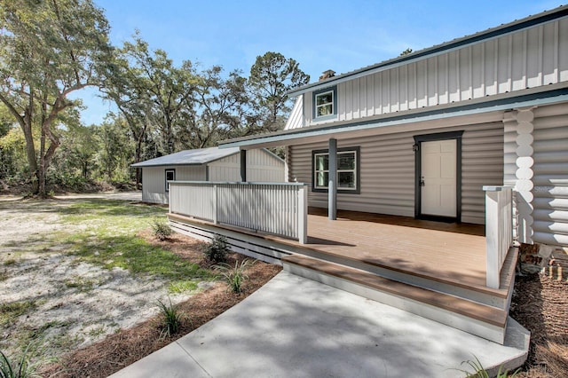 doorway to property with a wooden deck