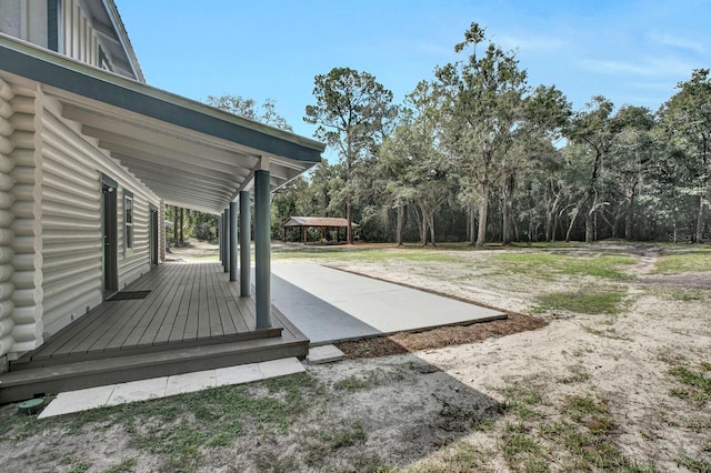 view of yard with a deck and a patio area