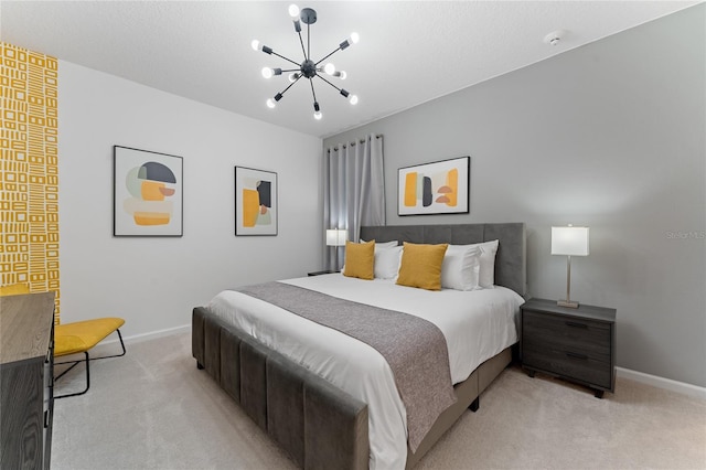 bedroom with light carpet and a chandelier