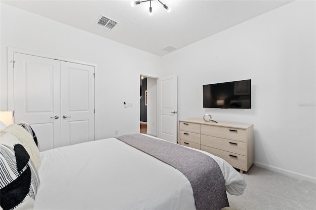 bedroom with a closet and carpet floors